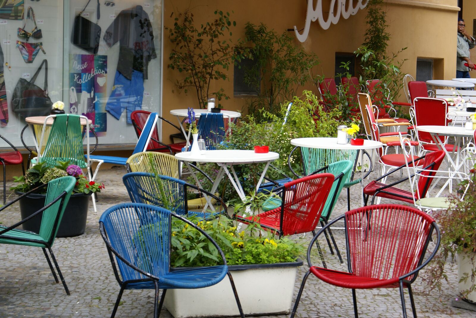 Sony Alpha DSLR-A100 sample photo. Chairs, colorful chairs, in photography