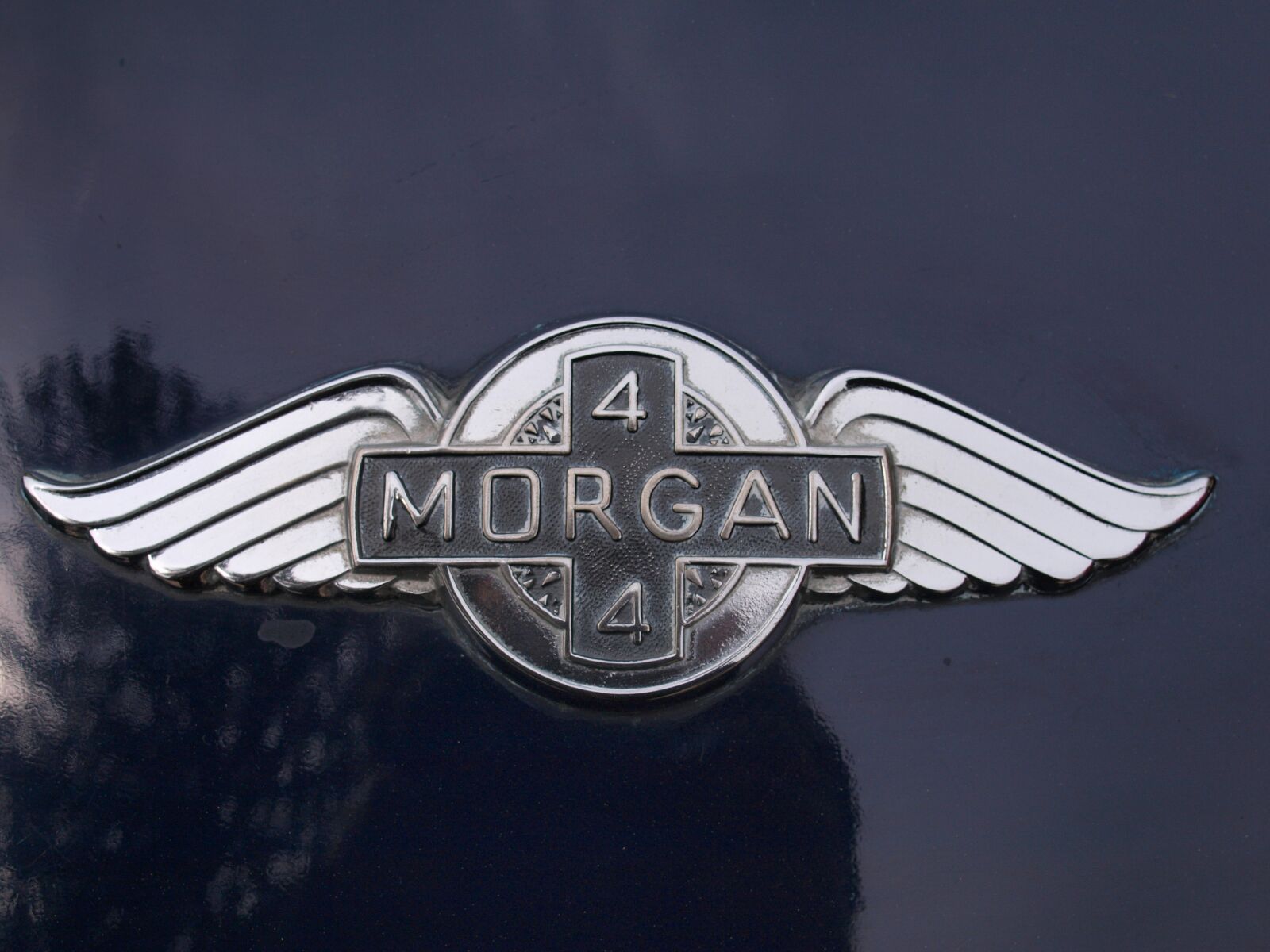Olympus E-520 (EVOLT E-520) sample photo. Car badge, metal, emblem photography