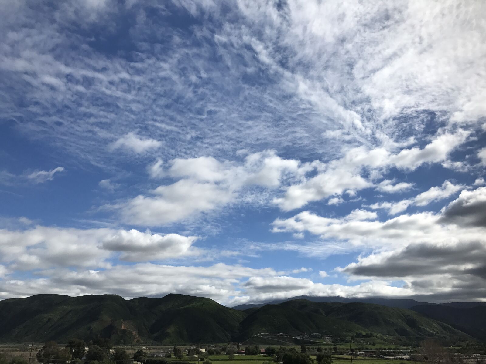 iPhone 7 back camera 3.99mm f/1.8 sample photo. Clouds, sky, mountains photography