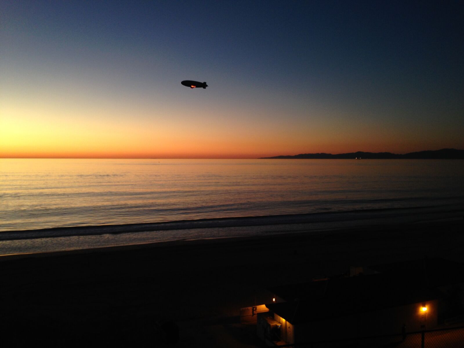 iPhone 5 back camera 4.12mm f/2.4 sample photo. Airship, blimp, sunset photography