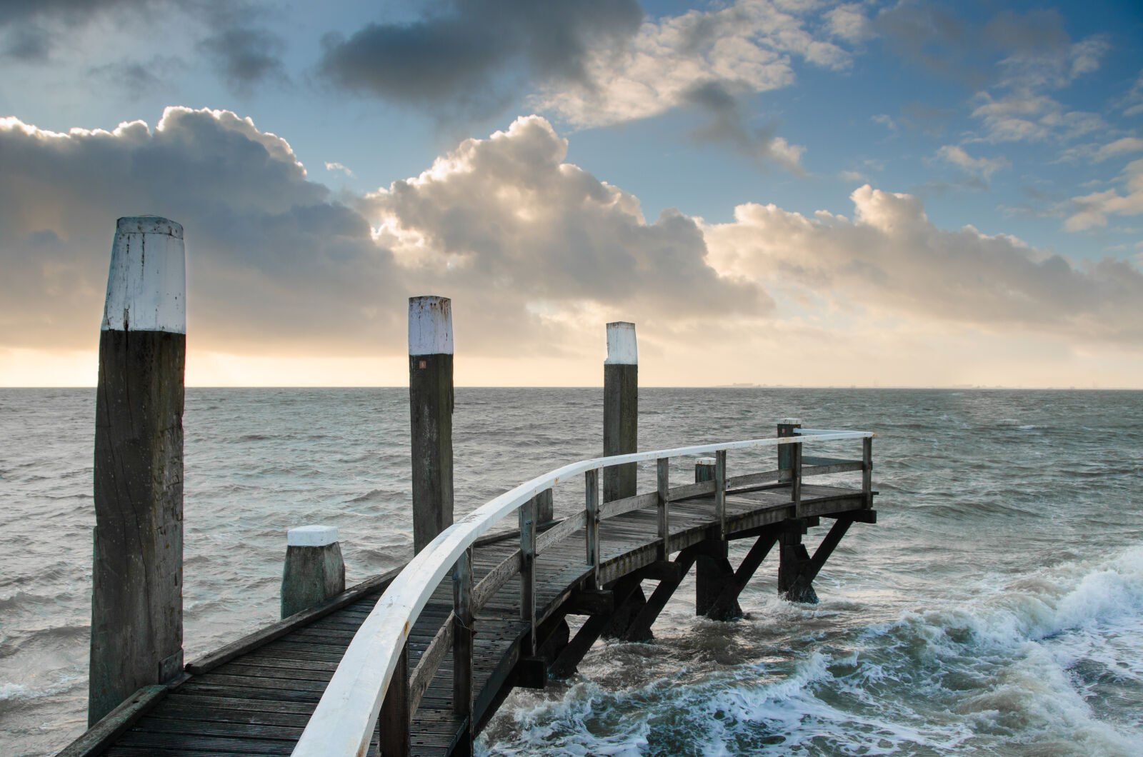 Nikon D7000 sample photo. Clouds, foam, ocean, pier photography