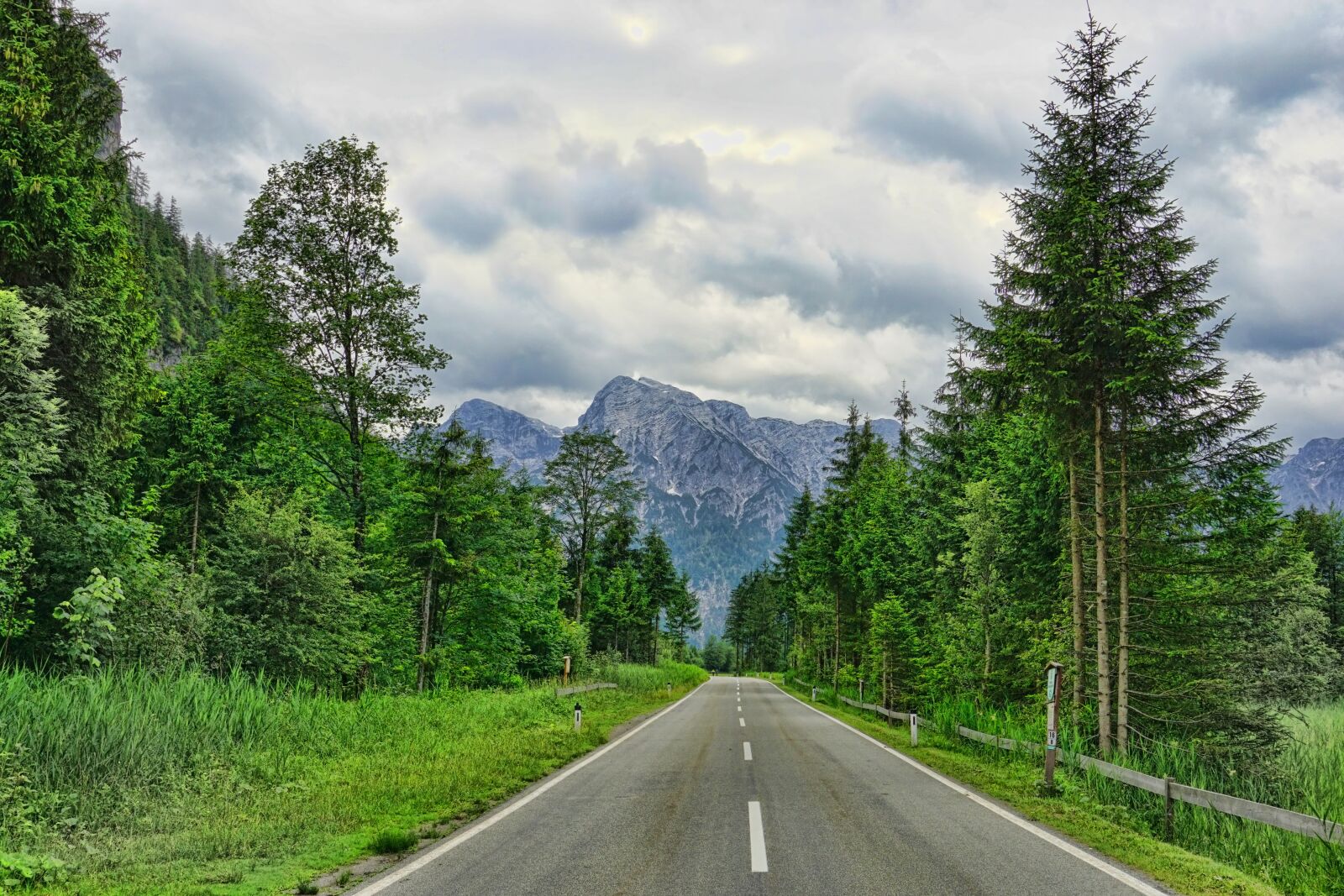 Sony E 18-135mm F3.5-5.6 OSS sample photo. Road, lonely road, mountains photography