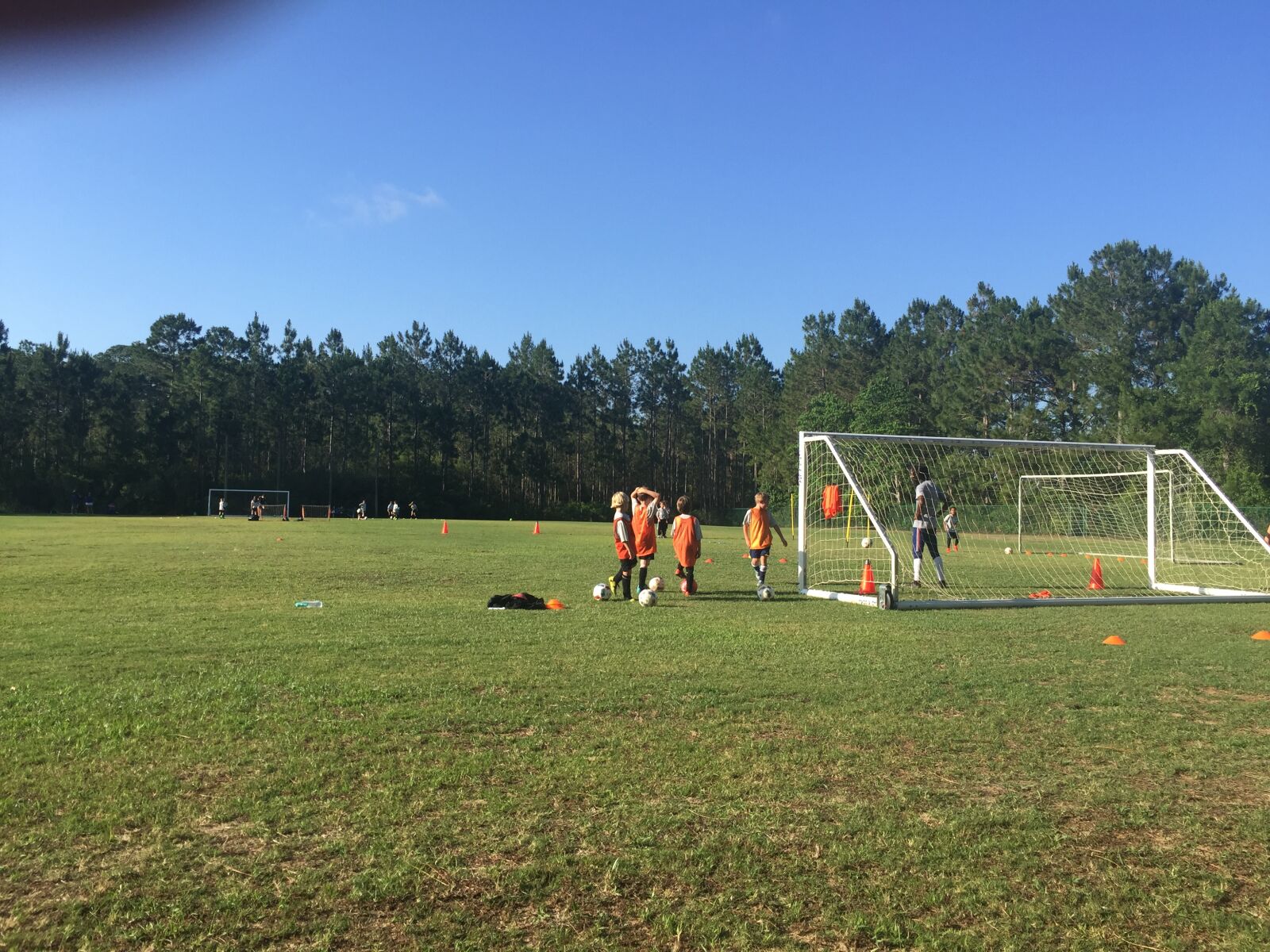 iPhone 6 Plus back camera 4.15mm f/2.2 sample photo. Grandson, plays, soccer photography