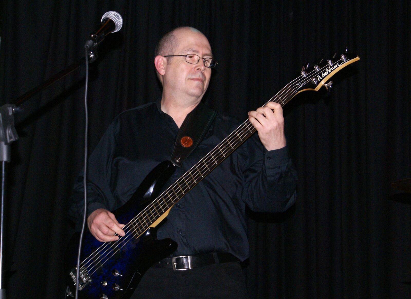 Sony Alpha DSLR-A100 sample photo. Bassist, rock musician, bass photography