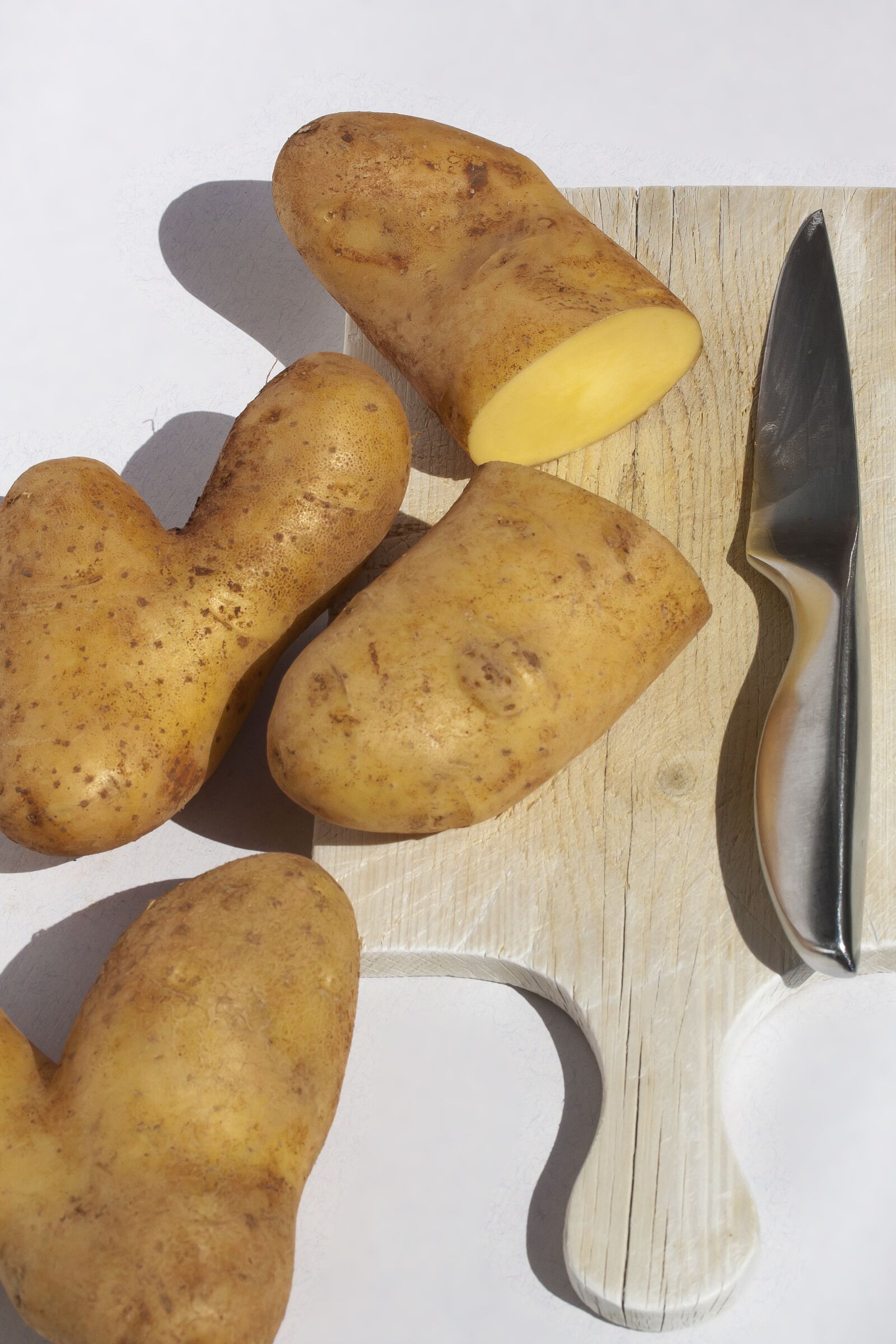 Canon EOS 50D + Canon EF-S 60mm F2.8 Macro USM sample photo. Potato, sliced, knife photography