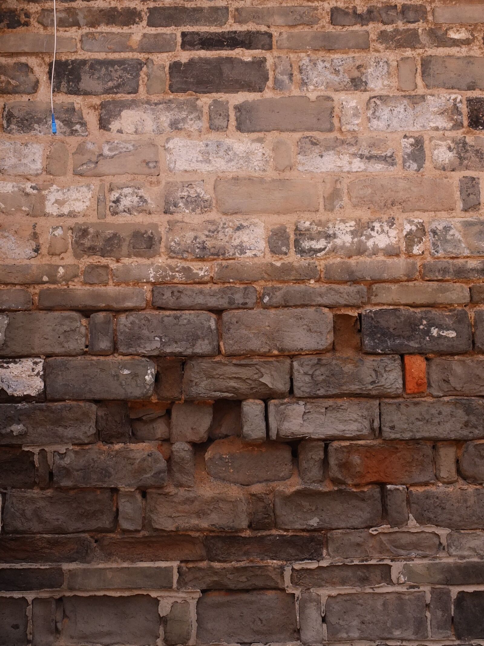 Fujifilm X10 sample photo. Broken fall, wall, building photography