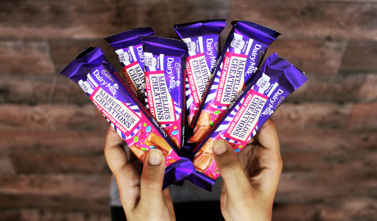 Canon EOS 1200D (EOS Rebel T5 / EOS Kiss X70 / EOS Hi) sample photo. Artsy, cadburry, chocolate, hands photography