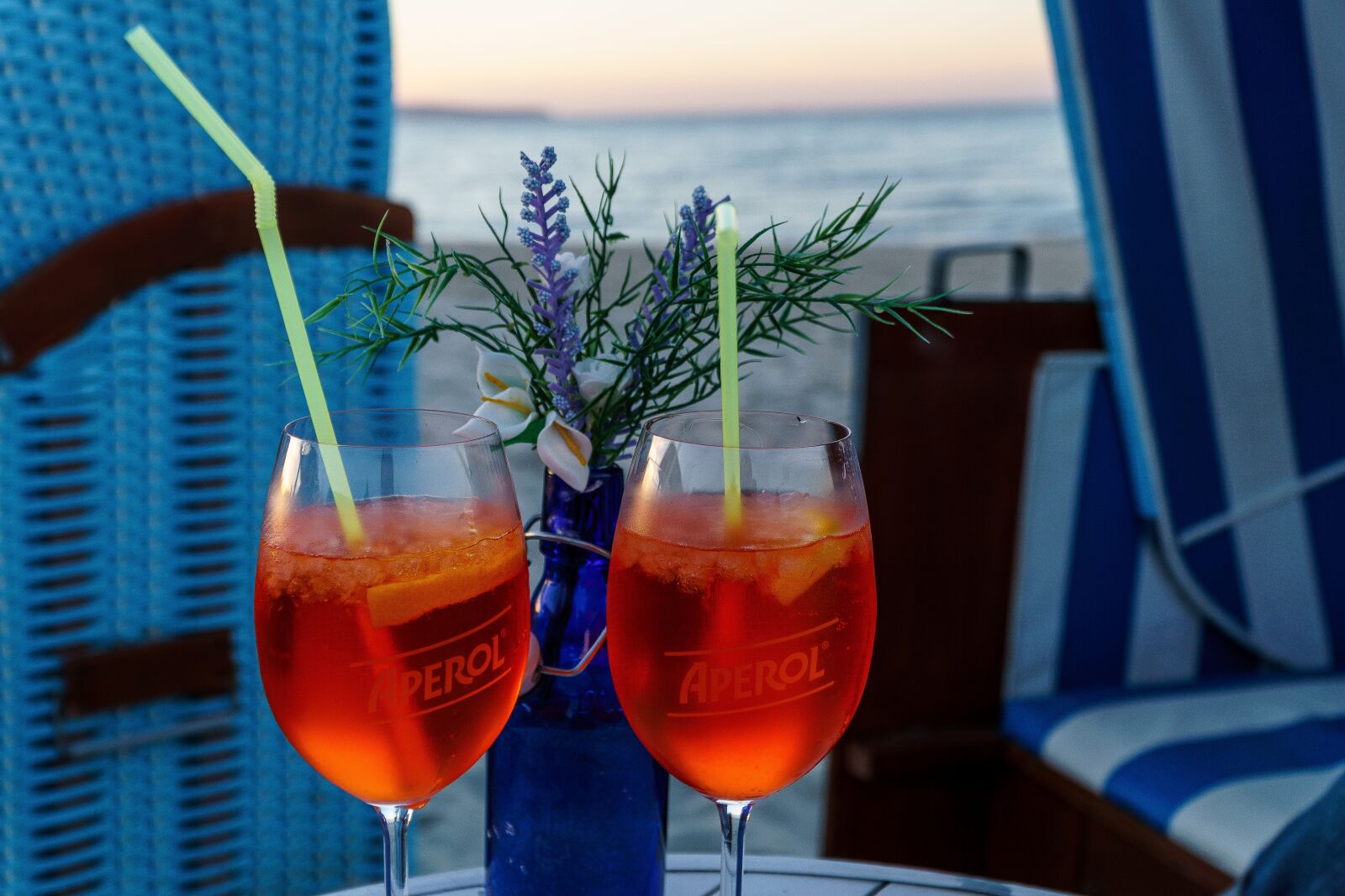 Sony a6000 + Sony E PZ 18-105mm F4 G OSS sample photo. Aperol, beach chair, beach photography
