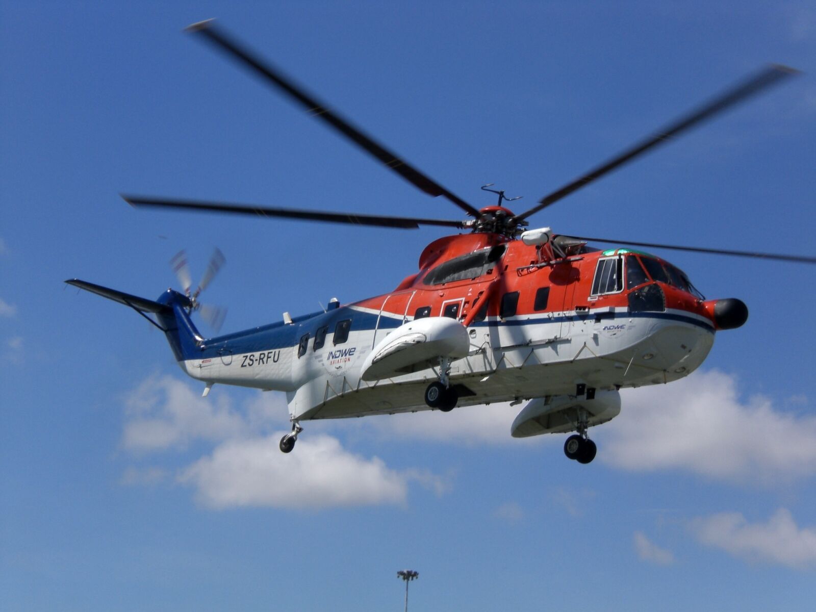 CASIO EX-Z77 sample photo. Helicopter, flying, sky photography