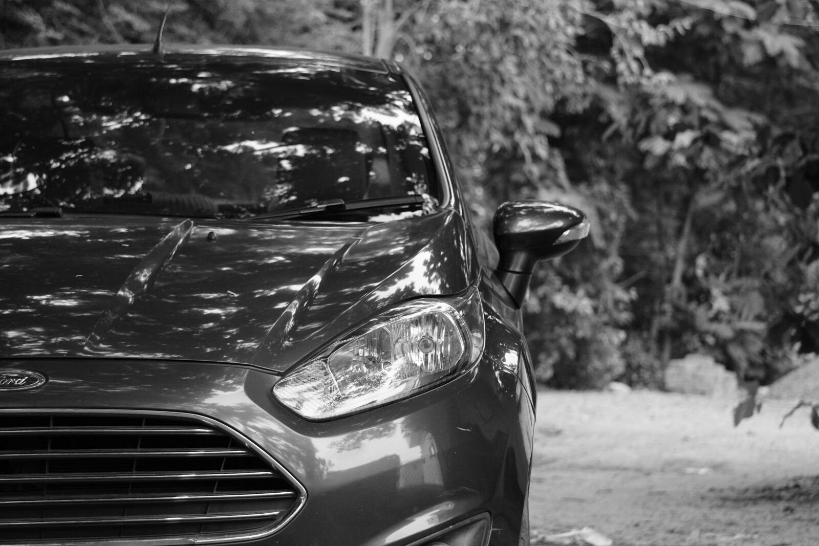 Sony E 55-210mm F4.5-6.3 OSS sample photo. Car, black and white photography