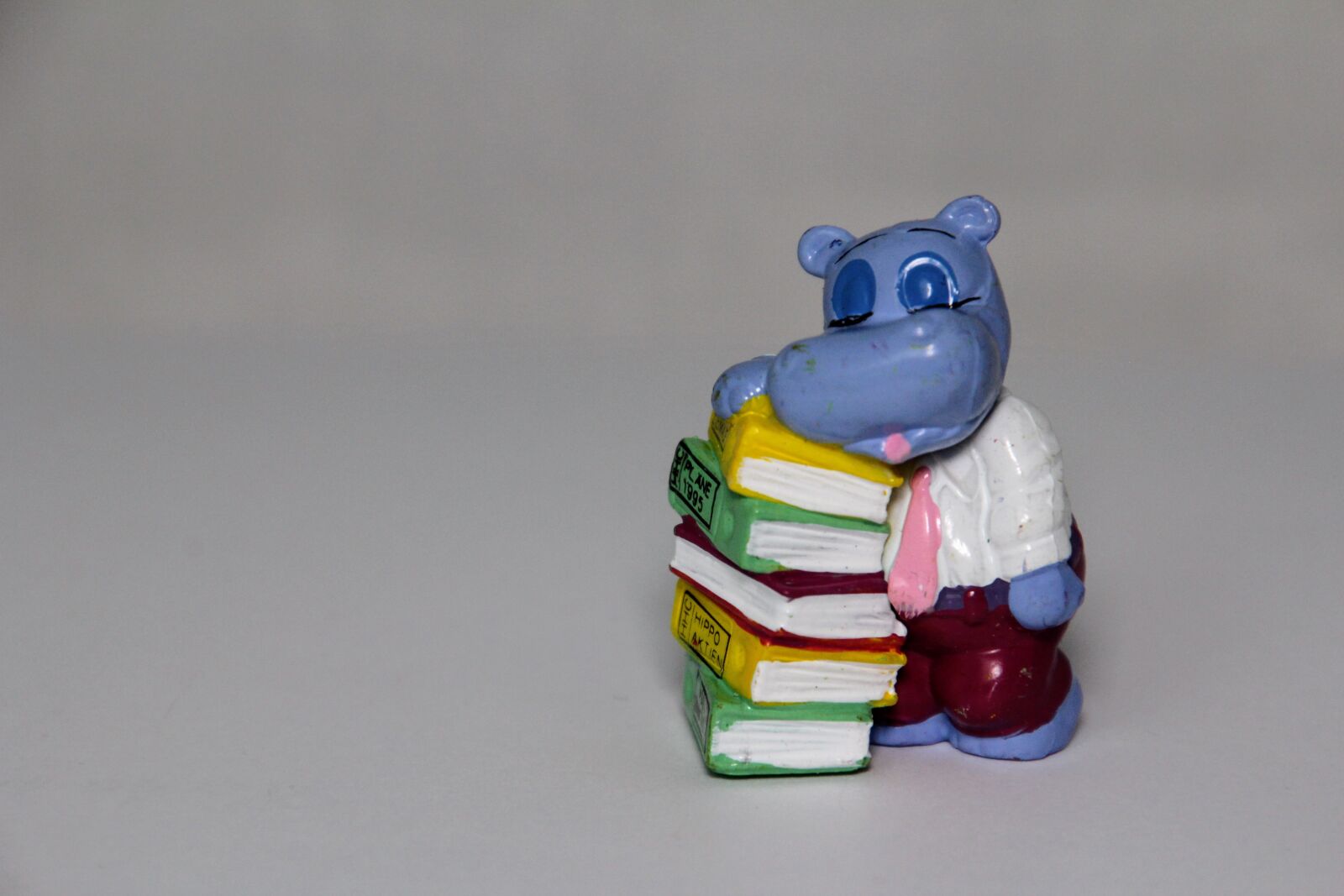 Canon EOS 60D sample photo. Books, stack, exhausted photography