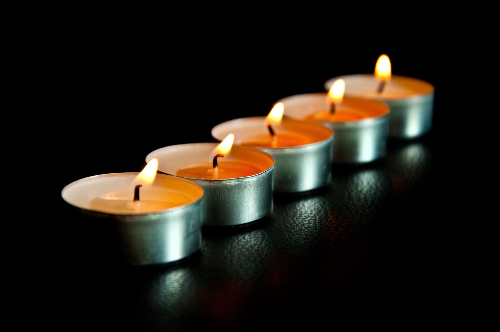 Nikon D90 sample photo. Candles, black background, light photography