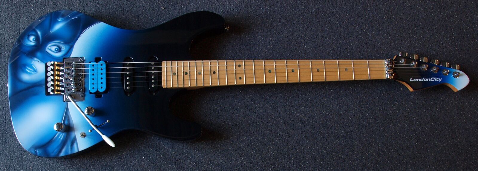 Olympus E-520 (EVOLT E-520) sample photo. Guitar, london city catwoman photography