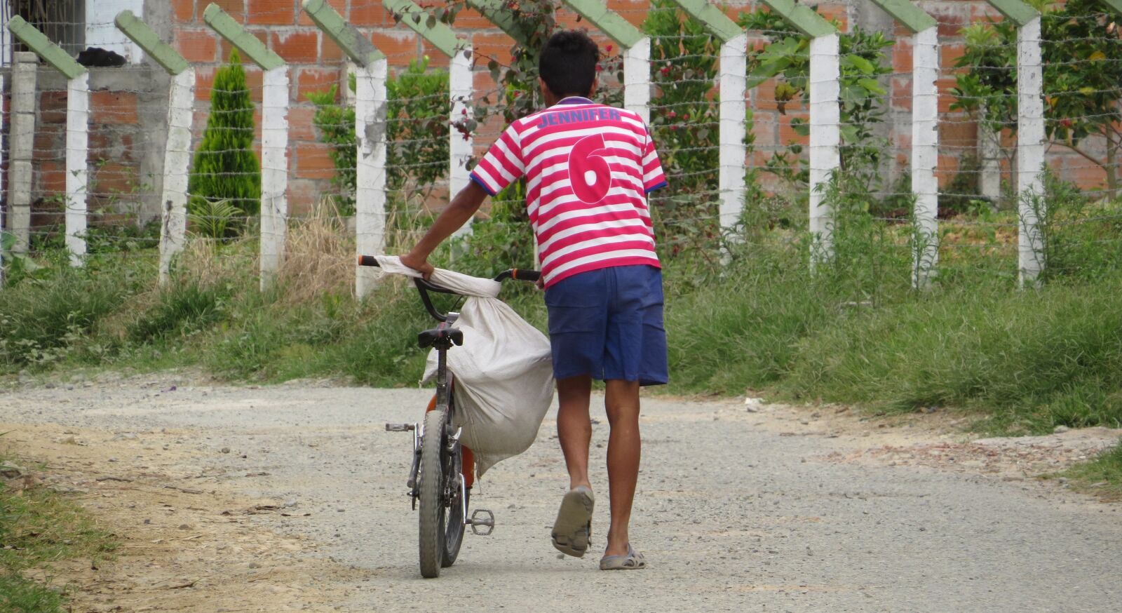 Canon PowerShot SX50 HS sample photo. Young, peasant, bicycle photography