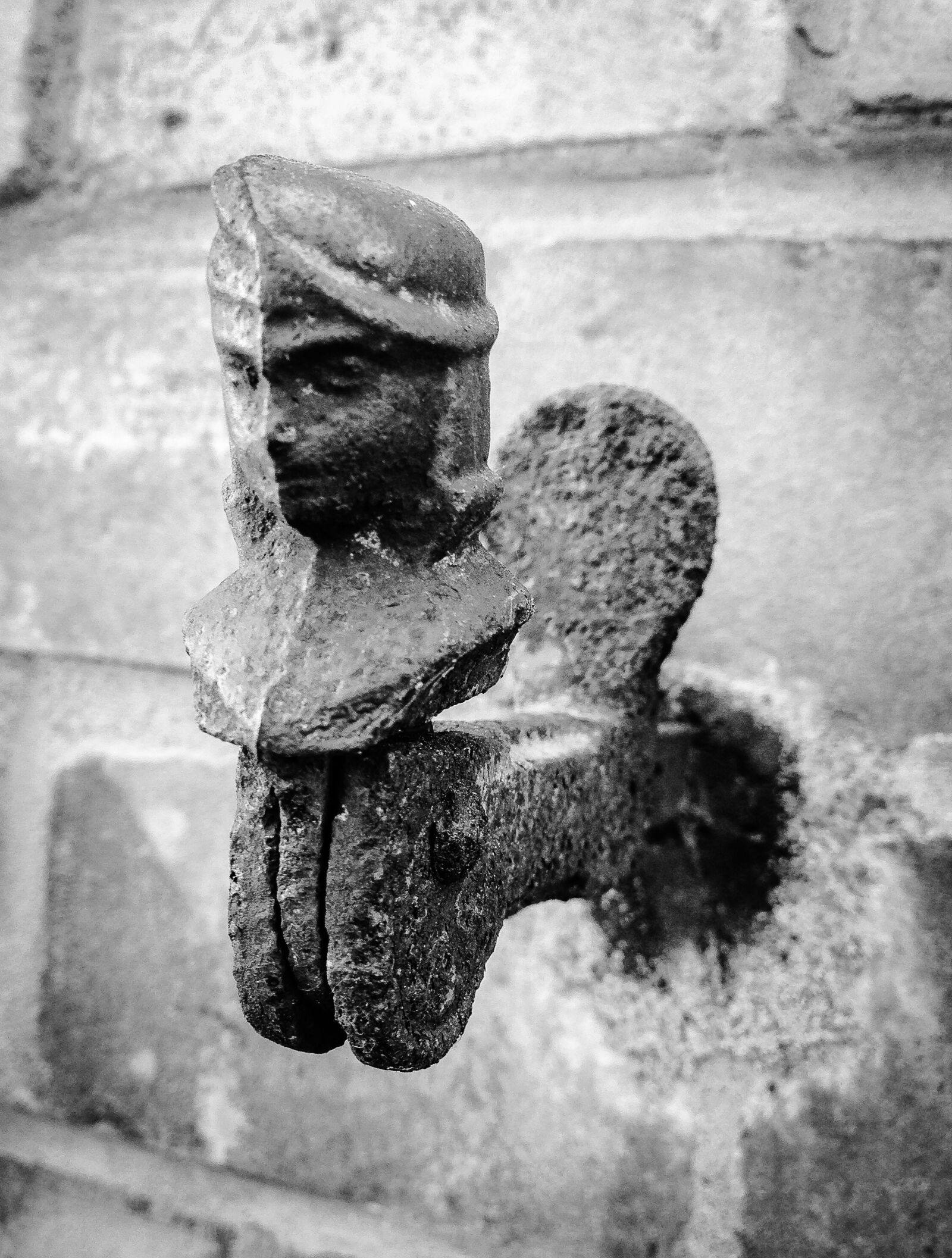 iPhone 5 back camera 4.12mm f/2.4 sample photo. Metal figure, wall figure photography