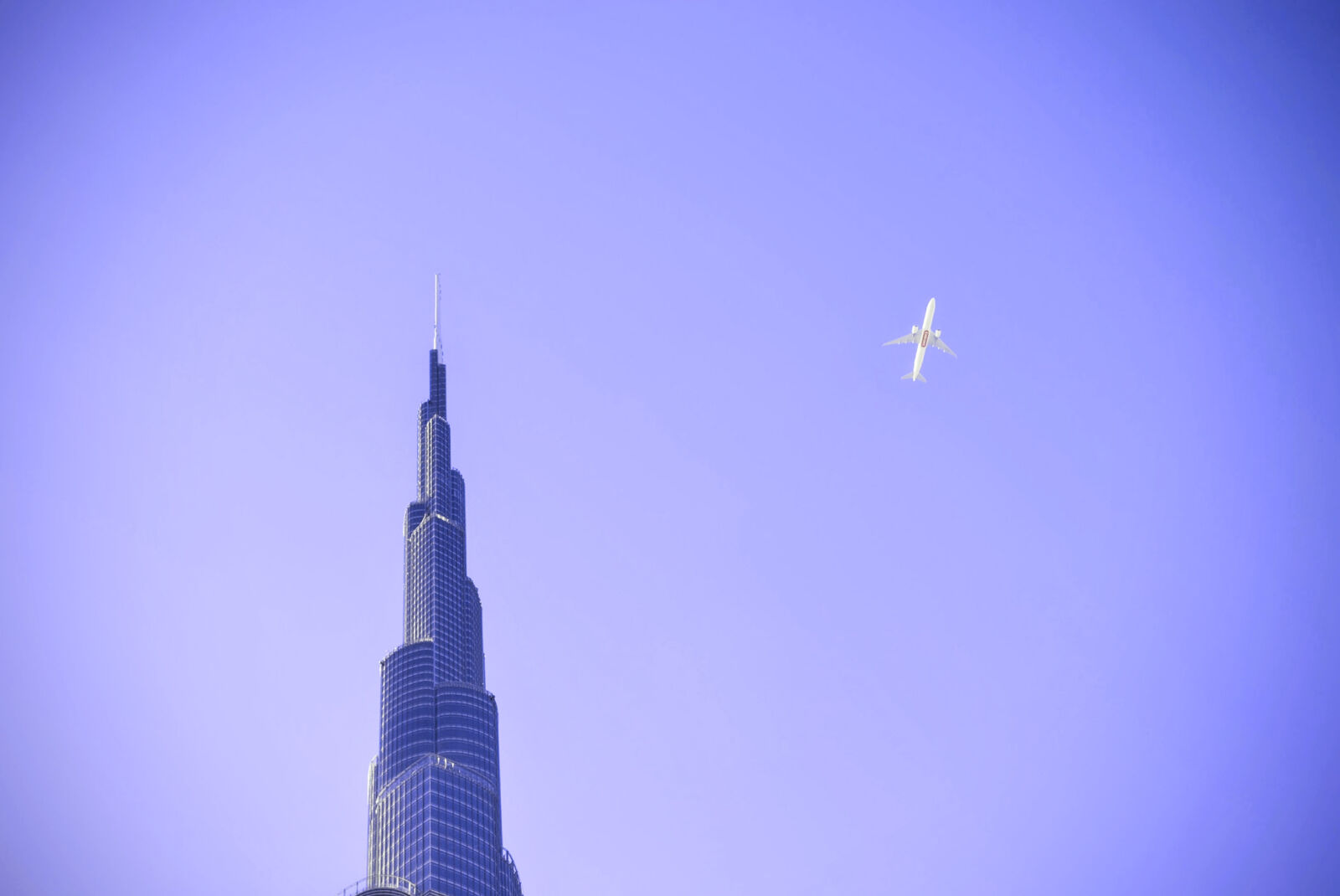 Nikon AF-S Nikkor 50mm F1.8G sample photo. Sky, purple, airplane, skyscraper photography