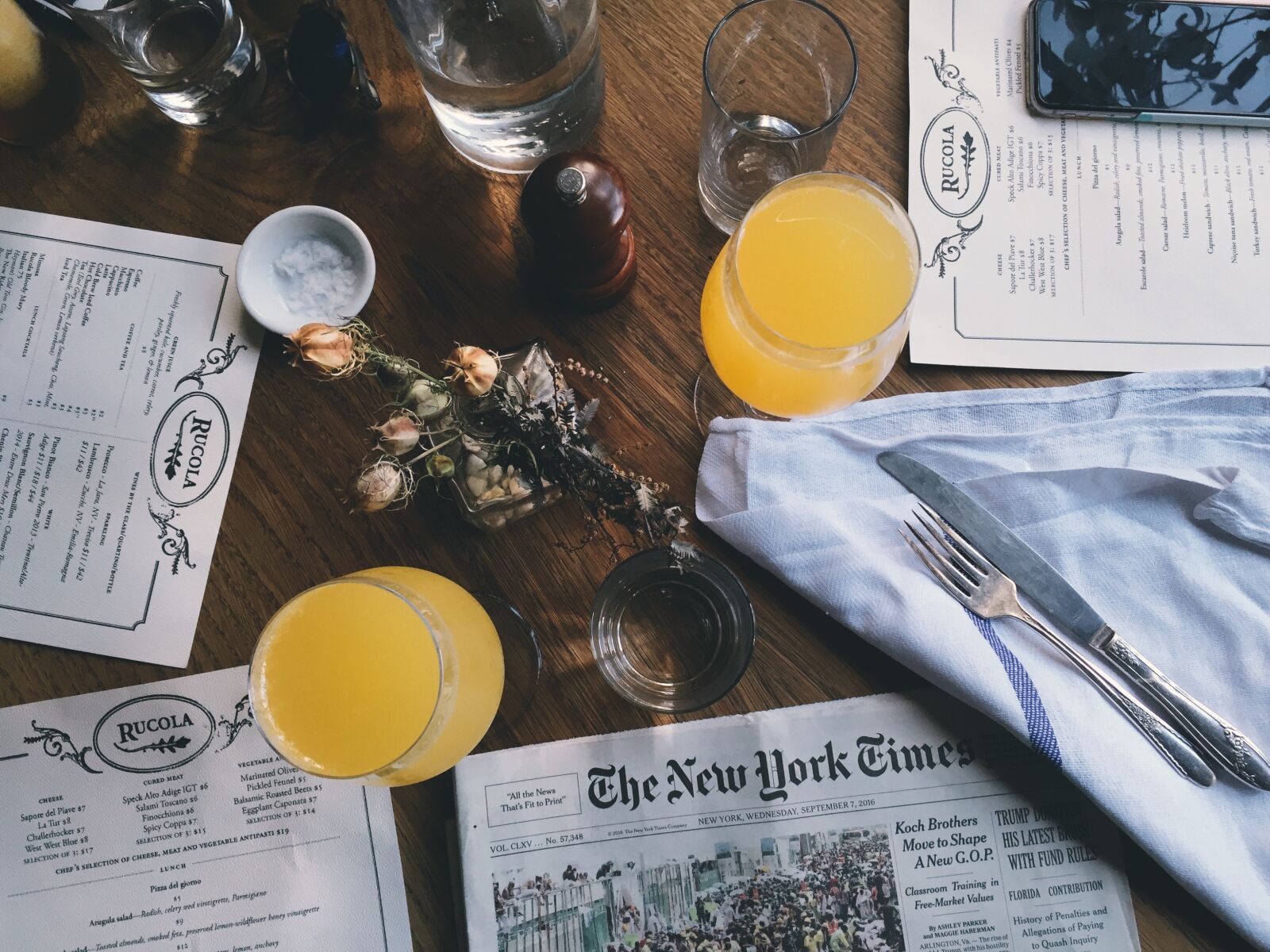 Apple iPhone 6 sample photo. Drinking glasses, drinks, newspaper photography