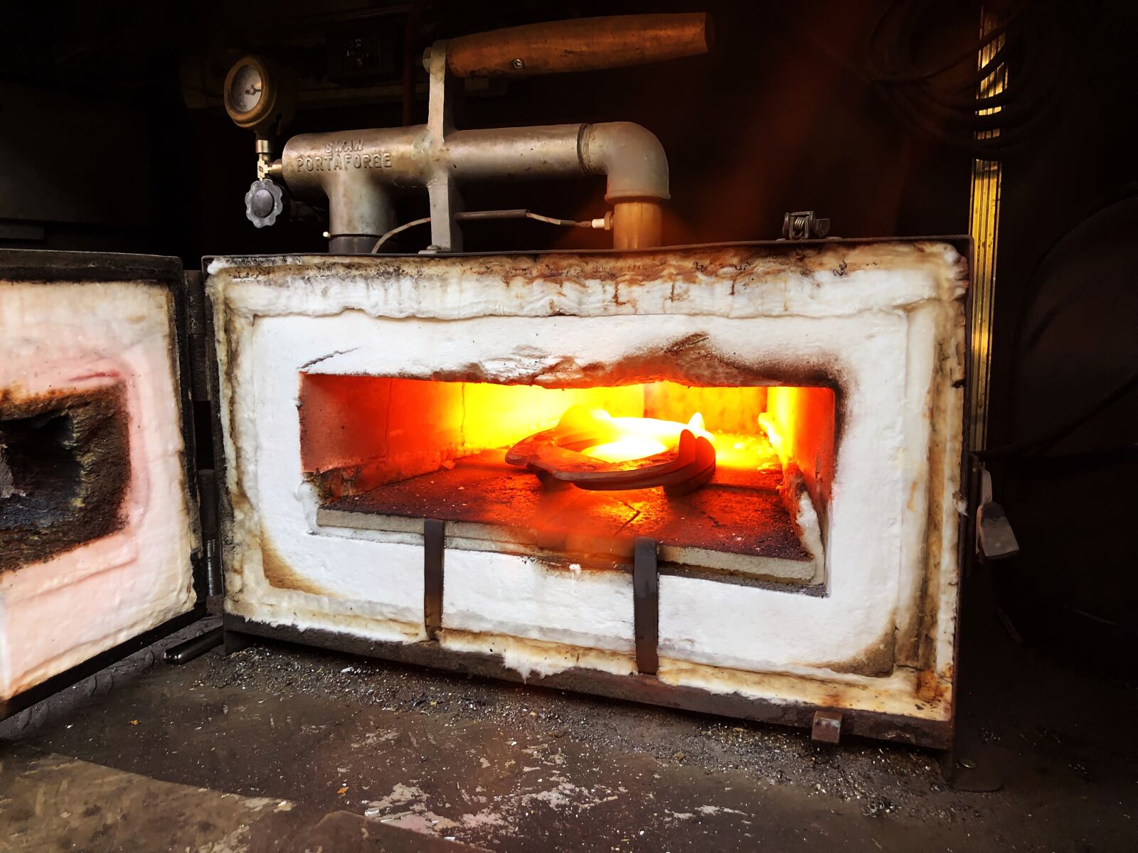 iPhone X back dual camera 4mm f/1.8 sample photo. Oven, horseshoe, farrier photography