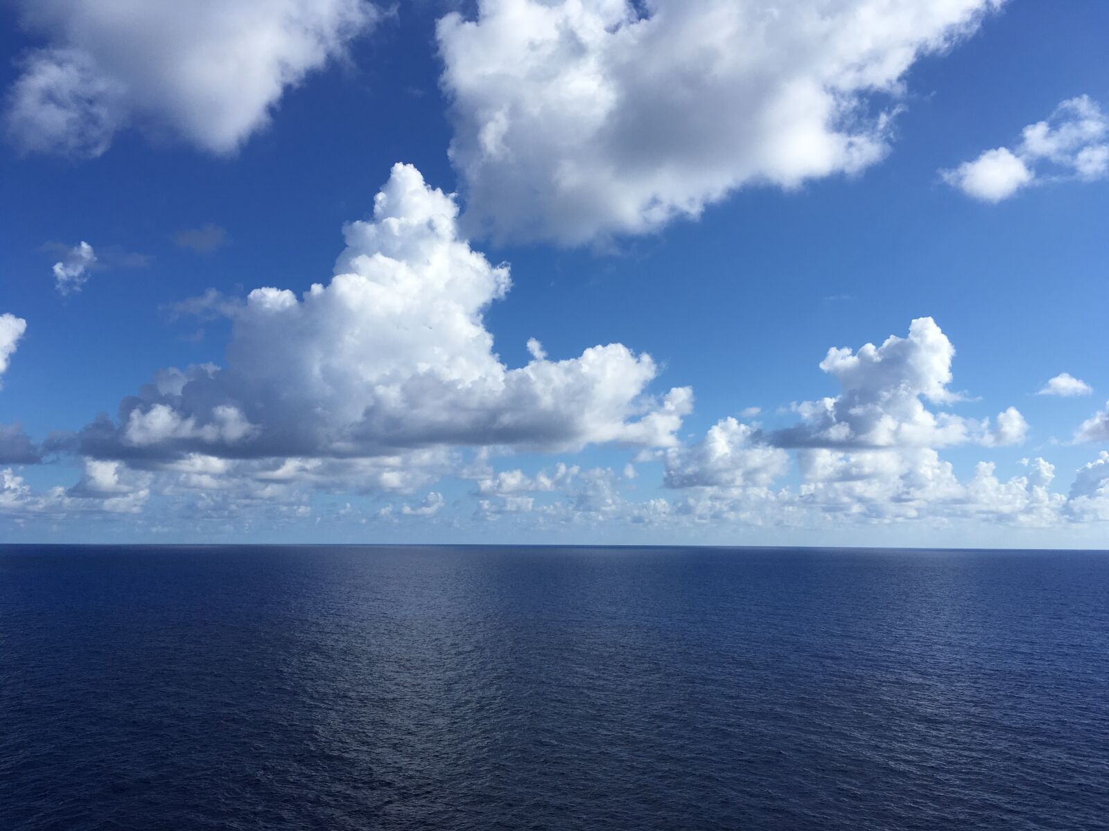 iPhone SE back camera 4.15mm f/2.2 sample photo. Clouds, ocean photography