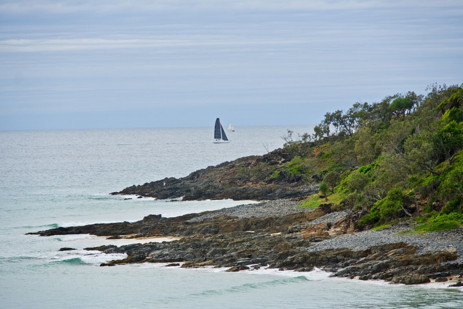 Sony E 18-135mm F3.5-5.6 OSS sample photo. Yacht, bluff, outcrop photography