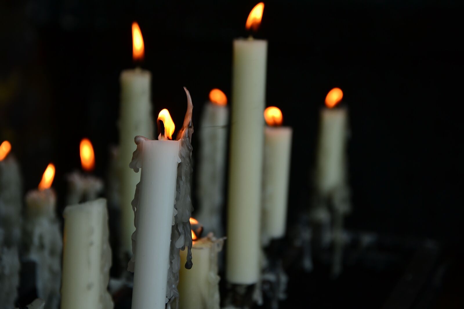 Nikon D3100 sample photo. Candles, church, funeral photography