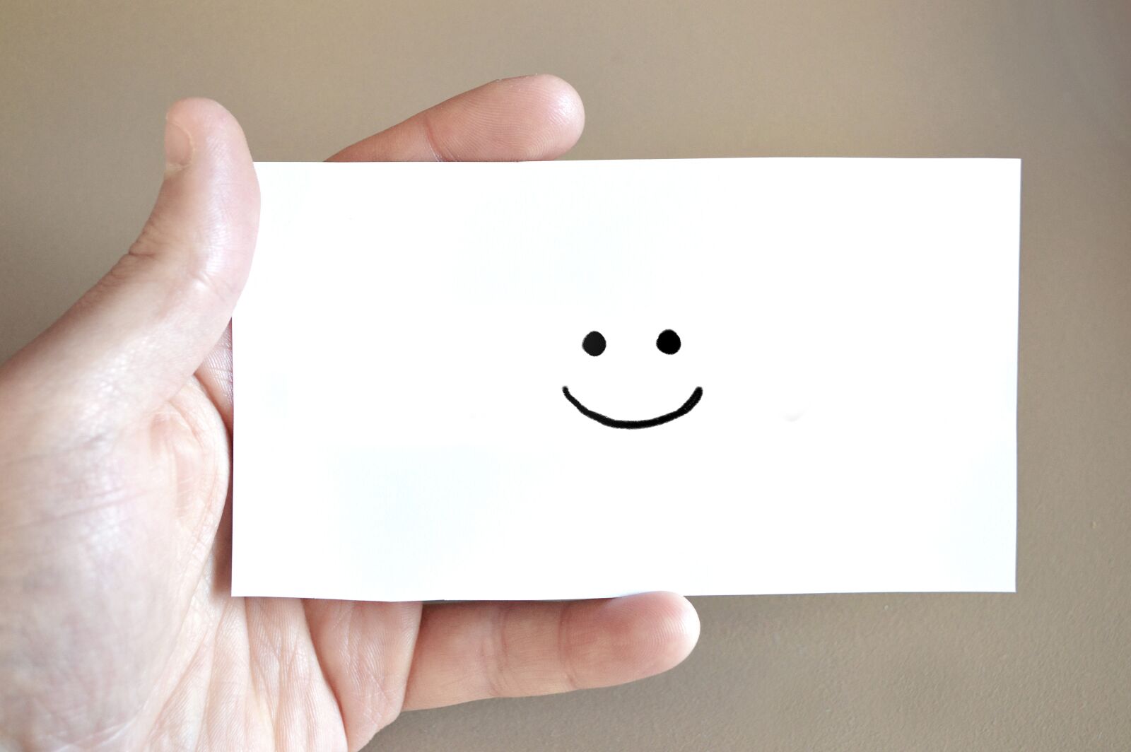Nikon D3200 sample photo. Smiley, map, hand photography