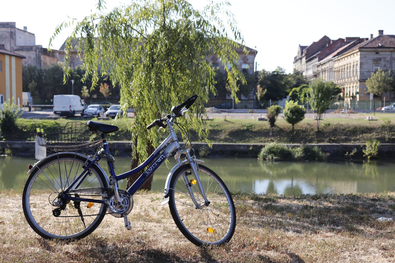 Canon EF-S 18-55mm F4-5.6 IS STM sample photo. Bicycle on river banks photography