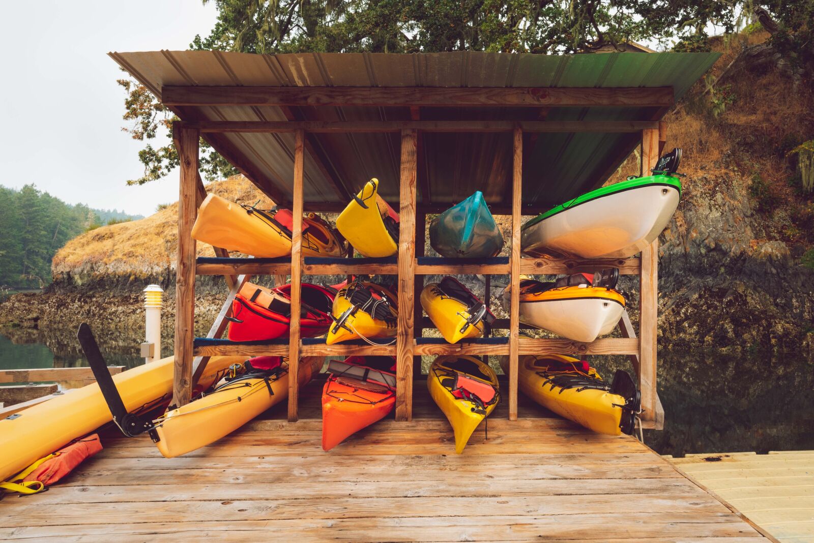 Nikon D750 sample photo. Kayaks, shed, stack photography