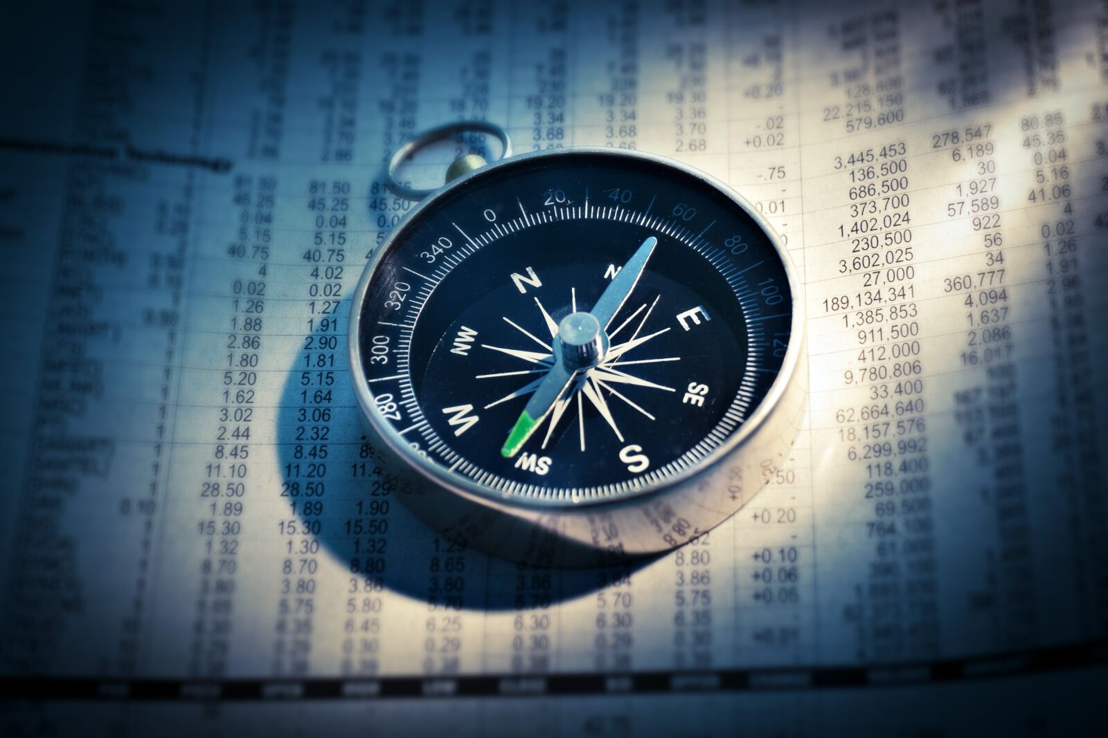 Canon EOS 500D (EOS Rebel T1i / EOS Kiss X3) sample photo. Compass, newspaper, finance photography