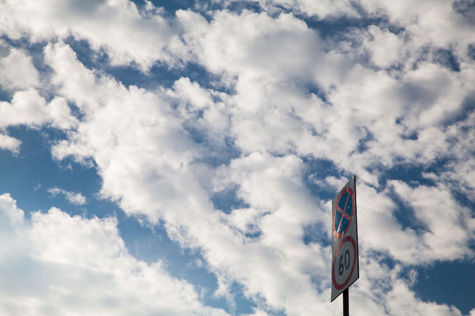 Canon EOS 5D Mark II sample photo. White cloud, signs, blue photography