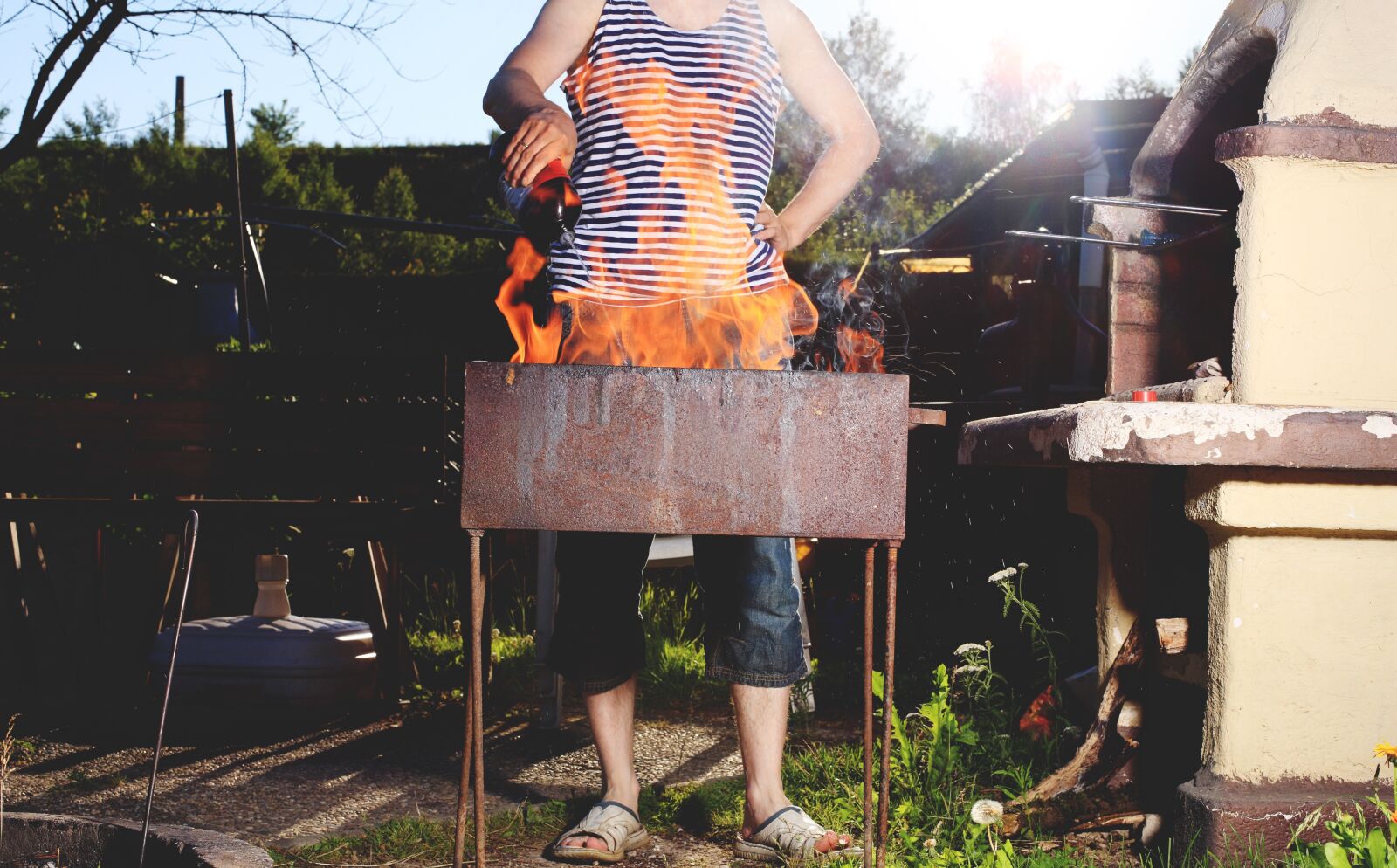 Canon EOS-1Ds Mark III sample photo. Fire, barbecue, man photography