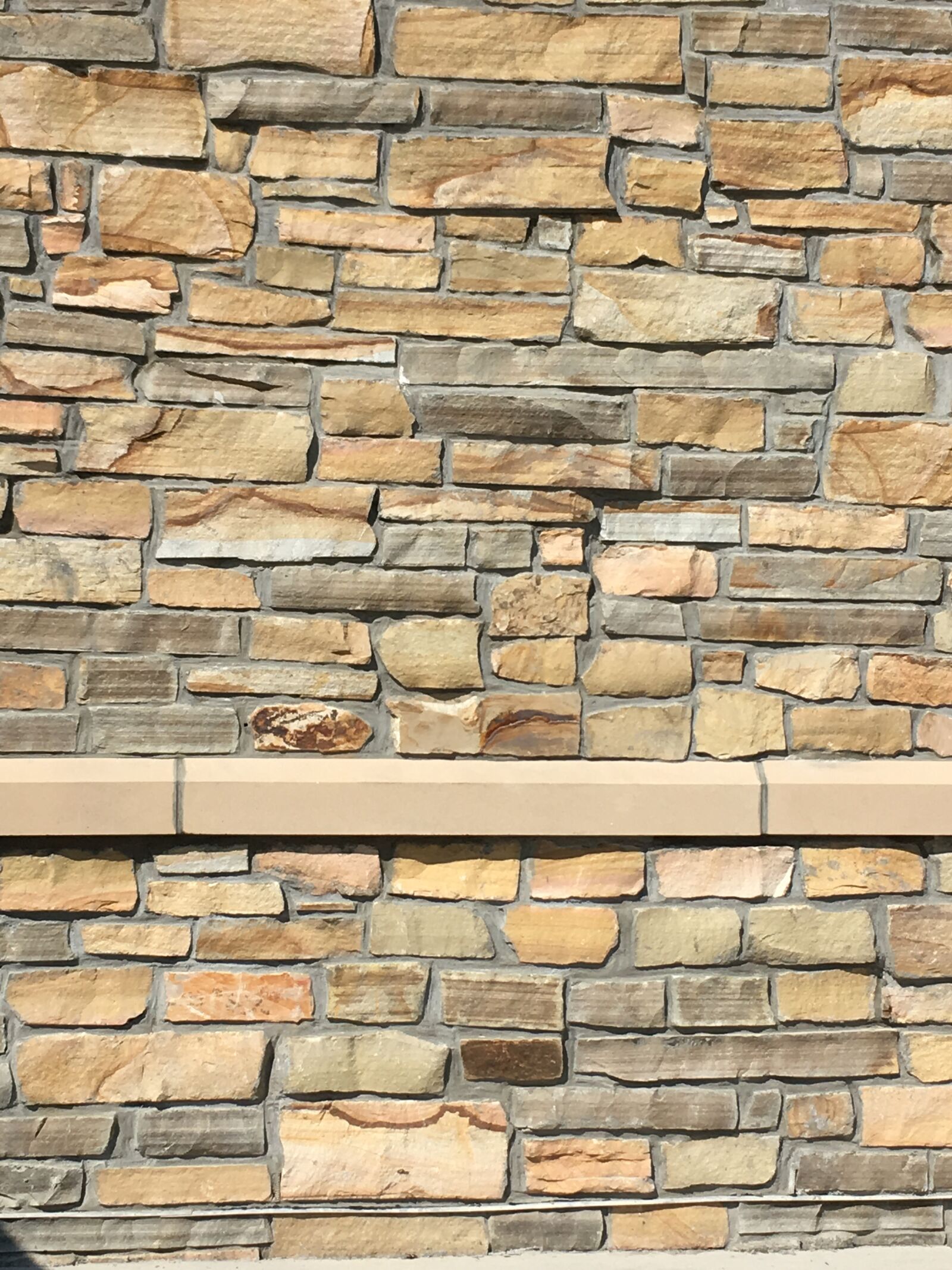 iPhone SE back camera 4.15mm f/2.2 sample photo. Stone texture, backdrop, wall photography