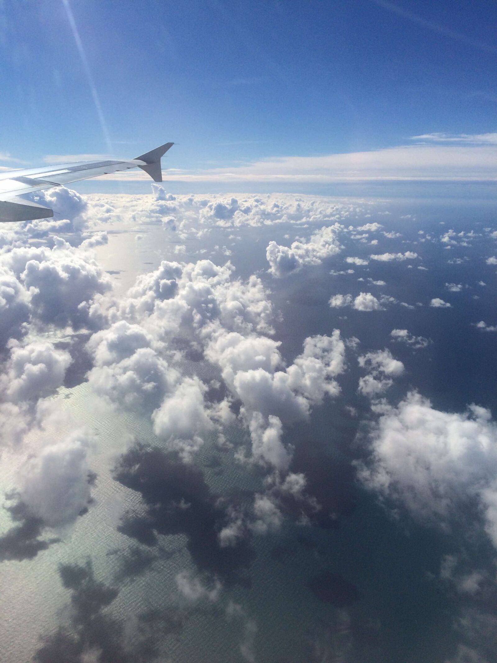 iPhone 5s back camera 4.15mm f/2.2 sample photo. Airplane, clouds, sky photography