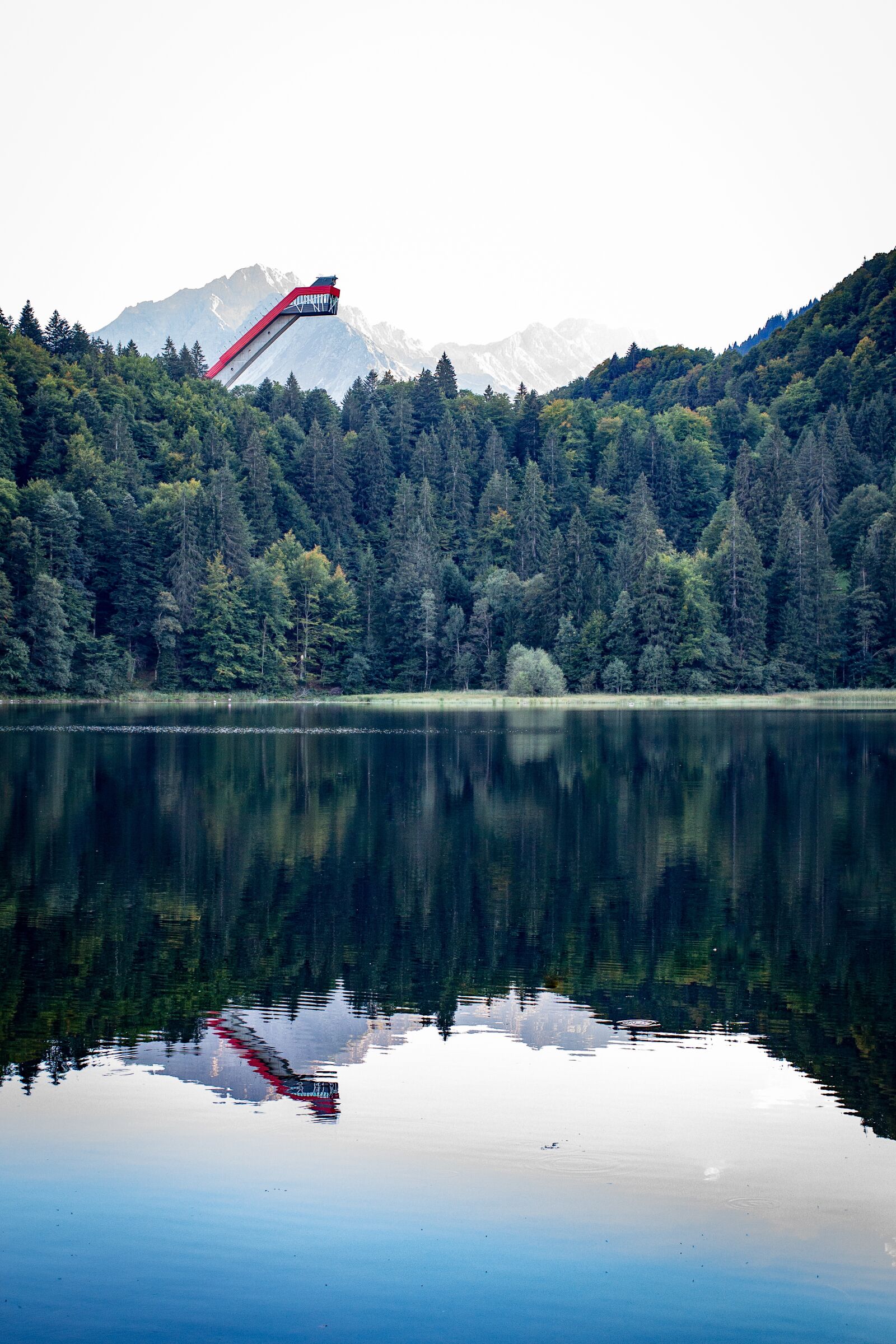 Canon EOS 700D (EOS Rebel T5i / EOS Kiss X7i) + Canon EF 40mm F2.8 STM sample photo. Lake, ski jump, forest photography
