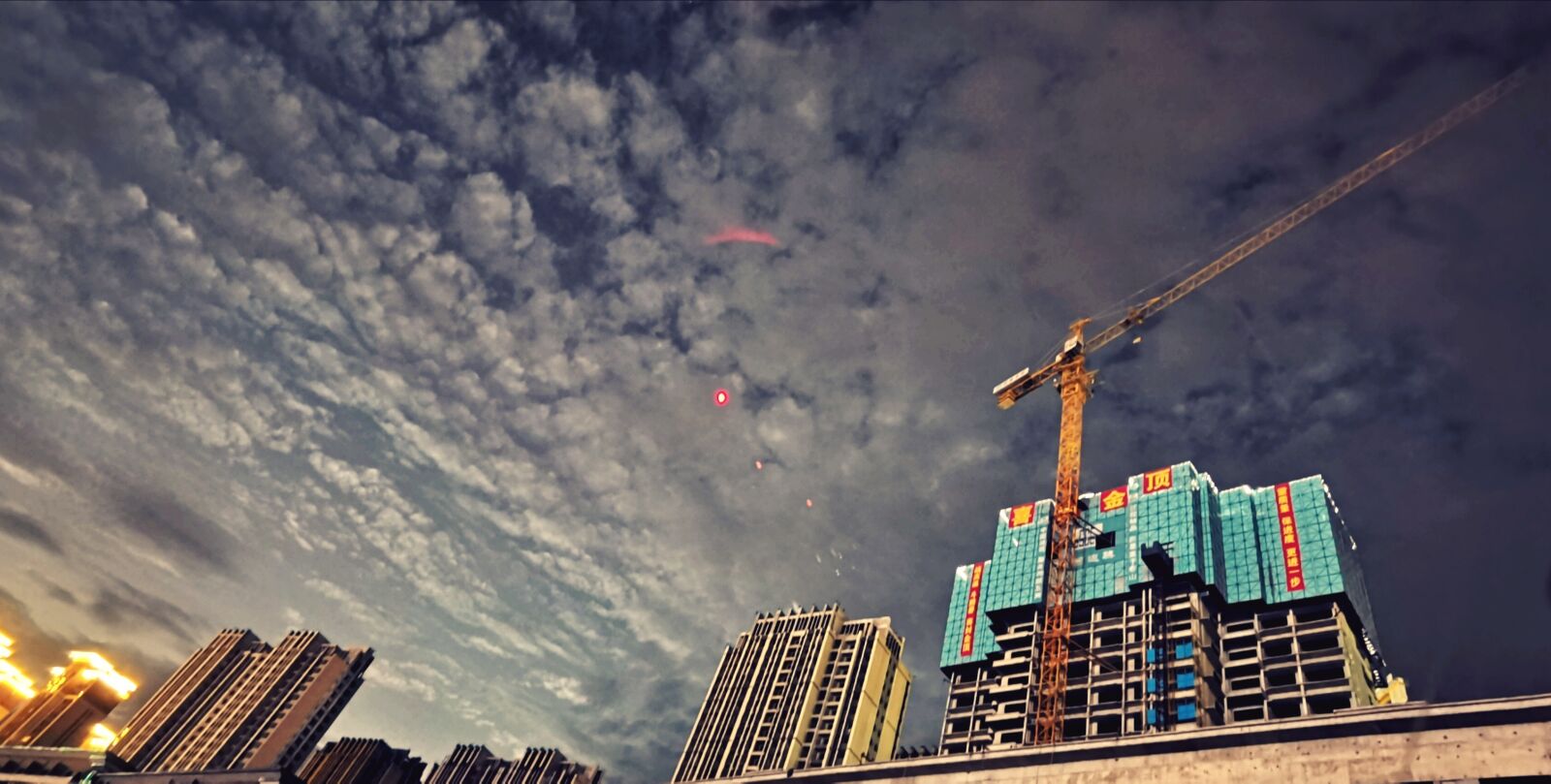 HUAWEI LIO-AN00 sample photo. Building, partly cloudy, crane photography