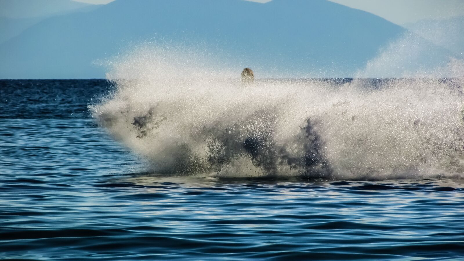 Canon PowerShot SX400 IS sample photo. Spray, jet ski, action photography