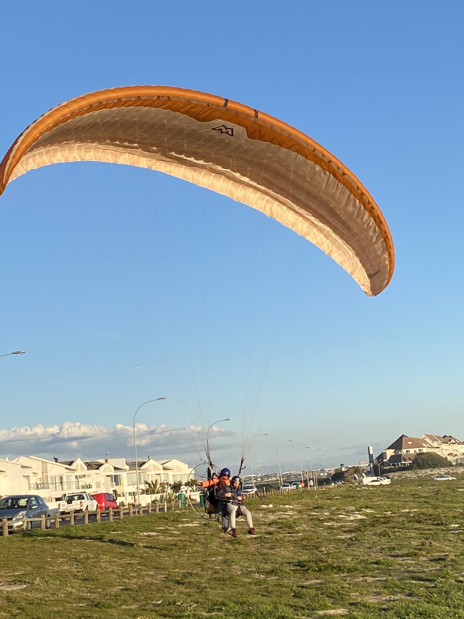 Apple iPhone 11 sample photo. Landing, tandem, paragliding photography