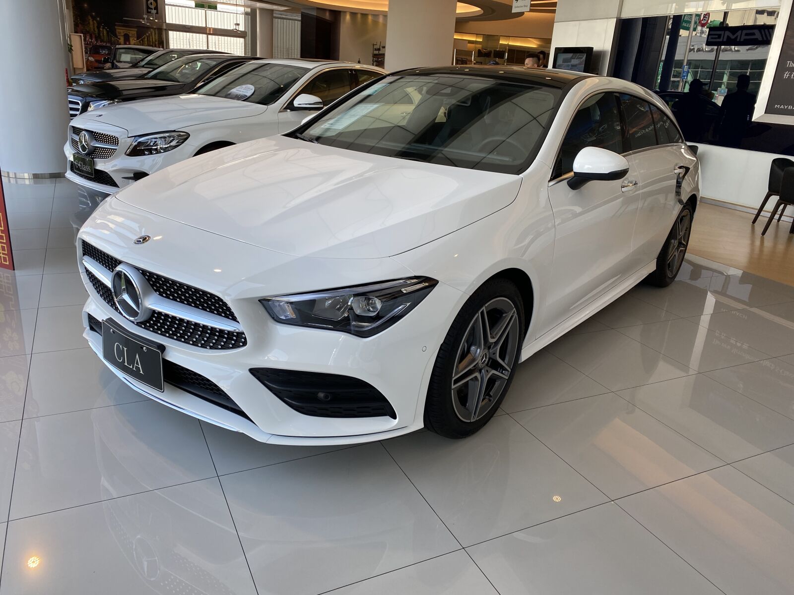 Apple iPhone 11 Pro Max sample photo. The automobile, white, cars photography
