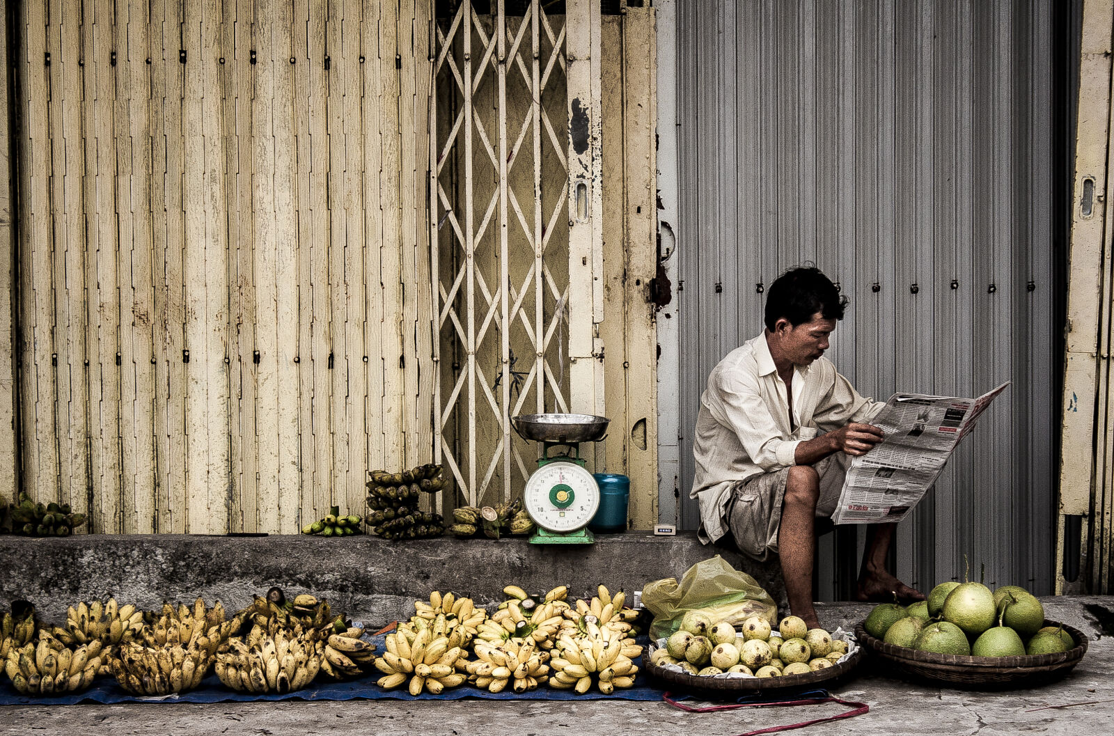 Canon EOS 30D sample photo. Man, sitting, near, fruits photography