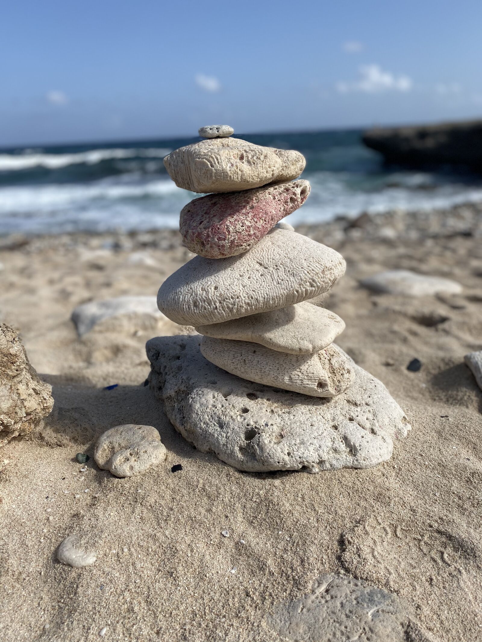 Apple iPhone 11 sample photo. Stacked rocks, aruba, beach photography