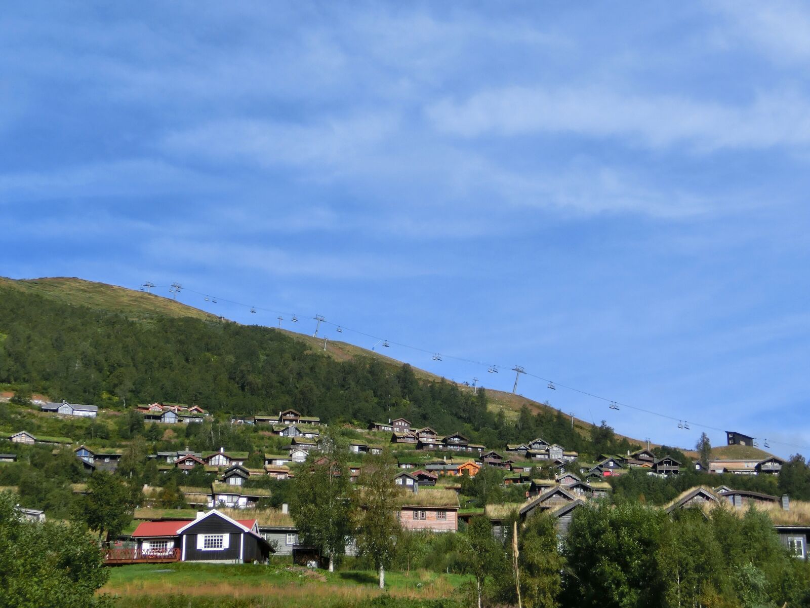 CASIO EX-ZR200 sample photo. Village, slope, houses photography