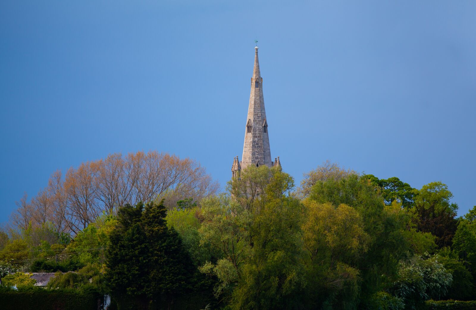 Canon EF 300mm F4L IS USM sample photo. Church spire, rain, summer photography