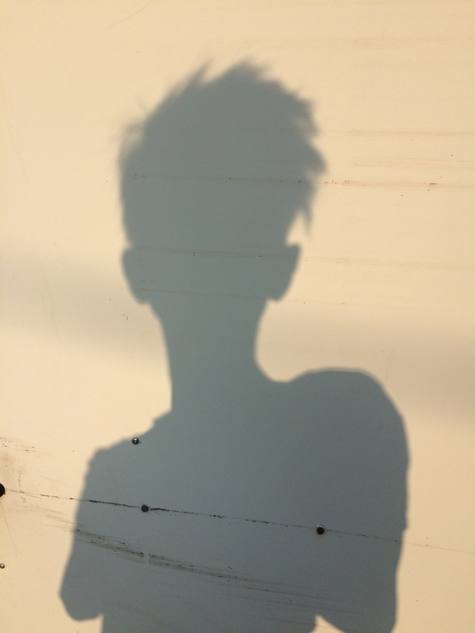 Apple iPhone 5s sample photo. Shadow, woman, short photography