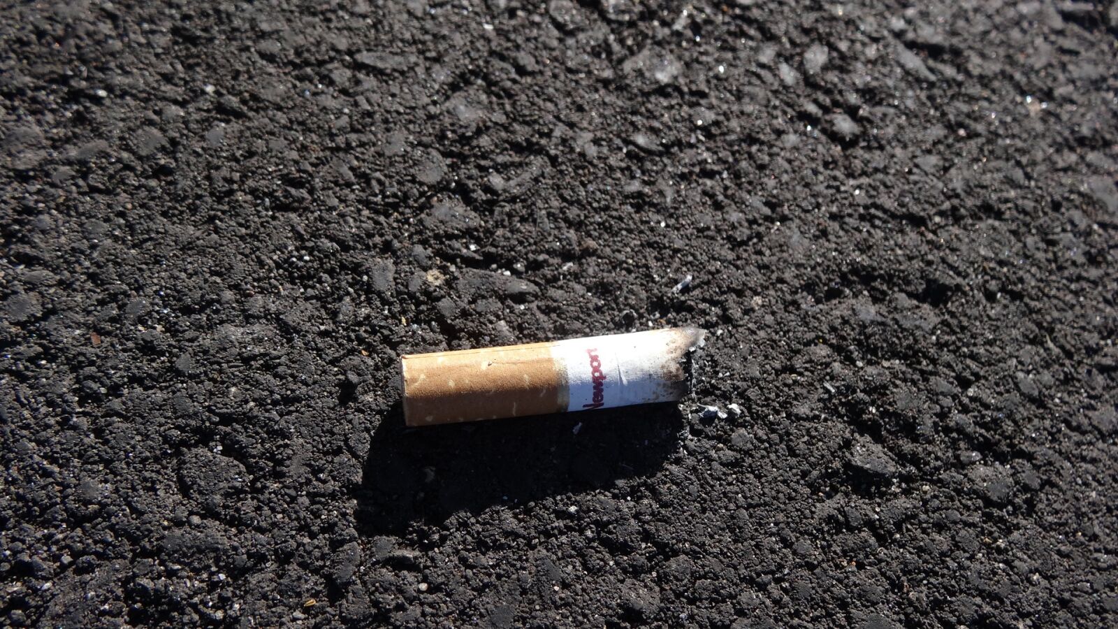 Sony Cyber-shot DSC-HX20V sample photo. Cigarette butt, pavement, road photography