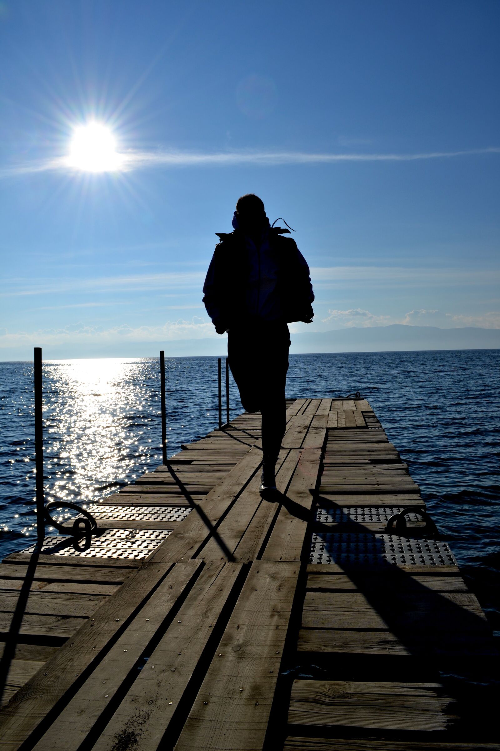 Nikon D3100 sample photo. Run, dock, sun photography