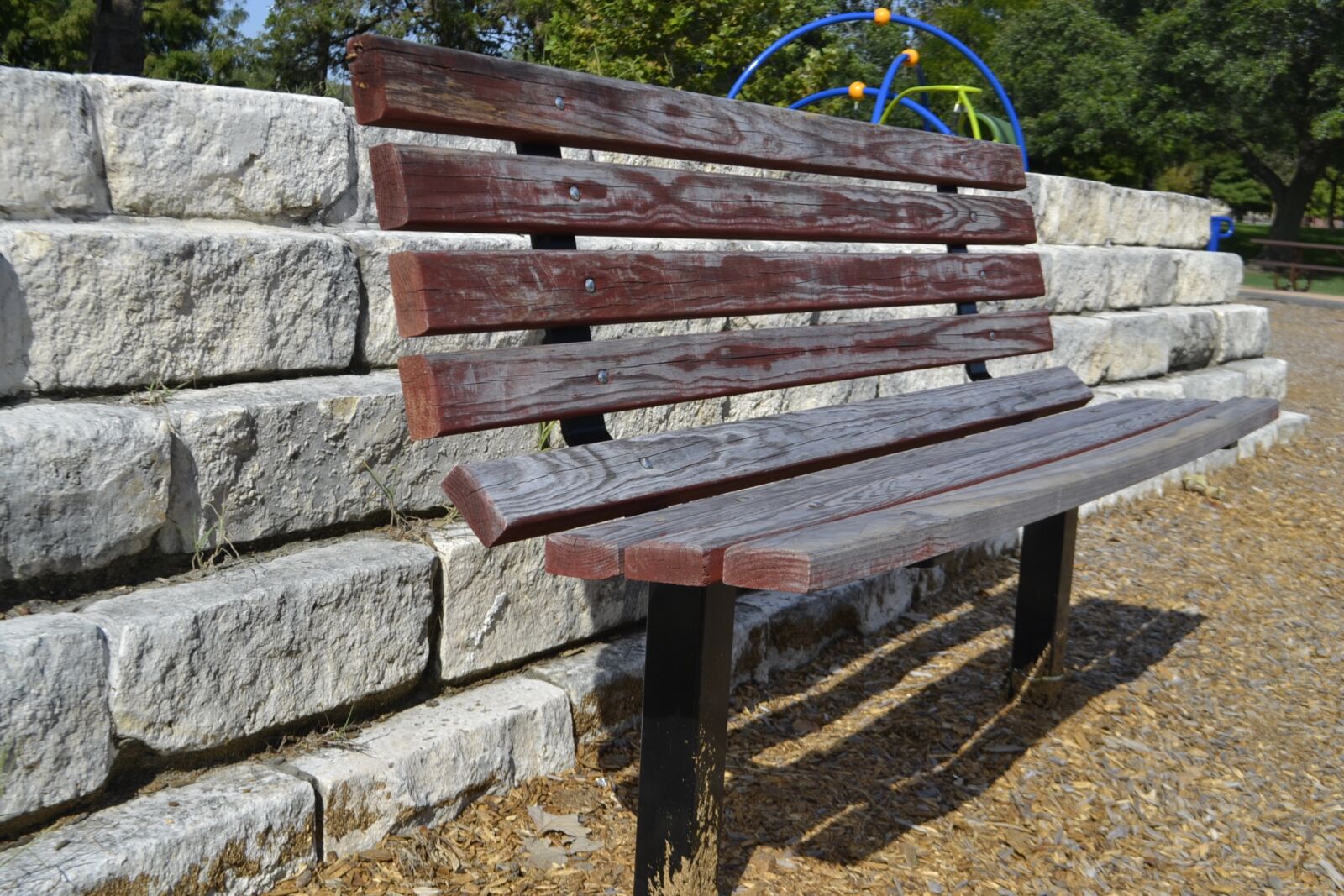 Nikon D3100 sample photo. Park bench, brick wall photography