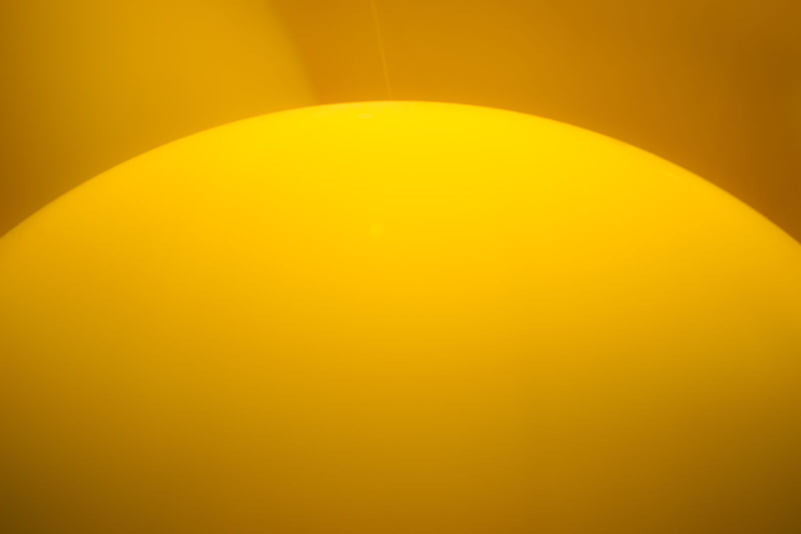 Sony Sonnar T* 135mm F1.8 ZA sample photo. Abstract, balloon, yellow photography
