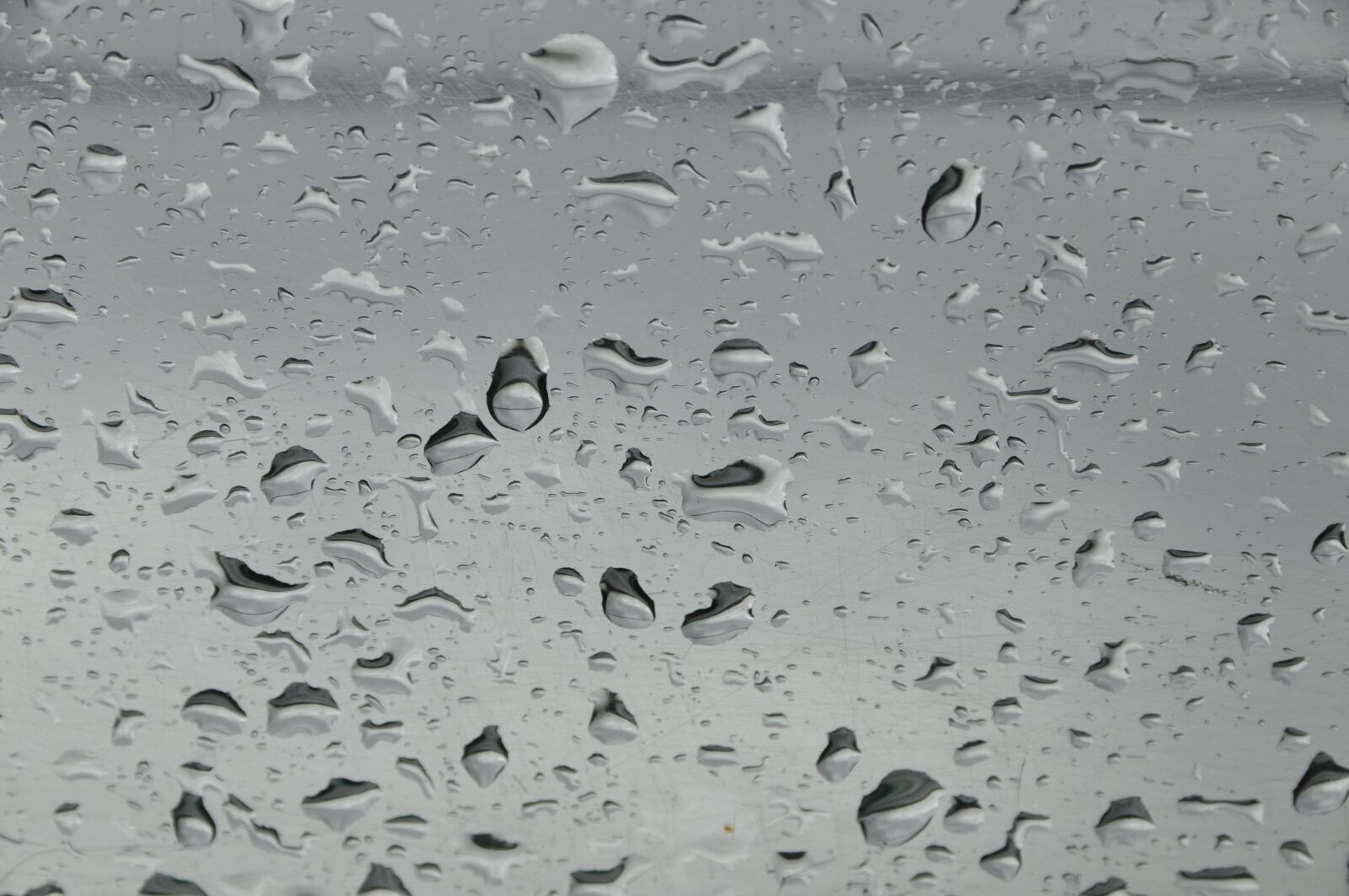 Nikon D300 sample photo. Drops on glass, rain photography