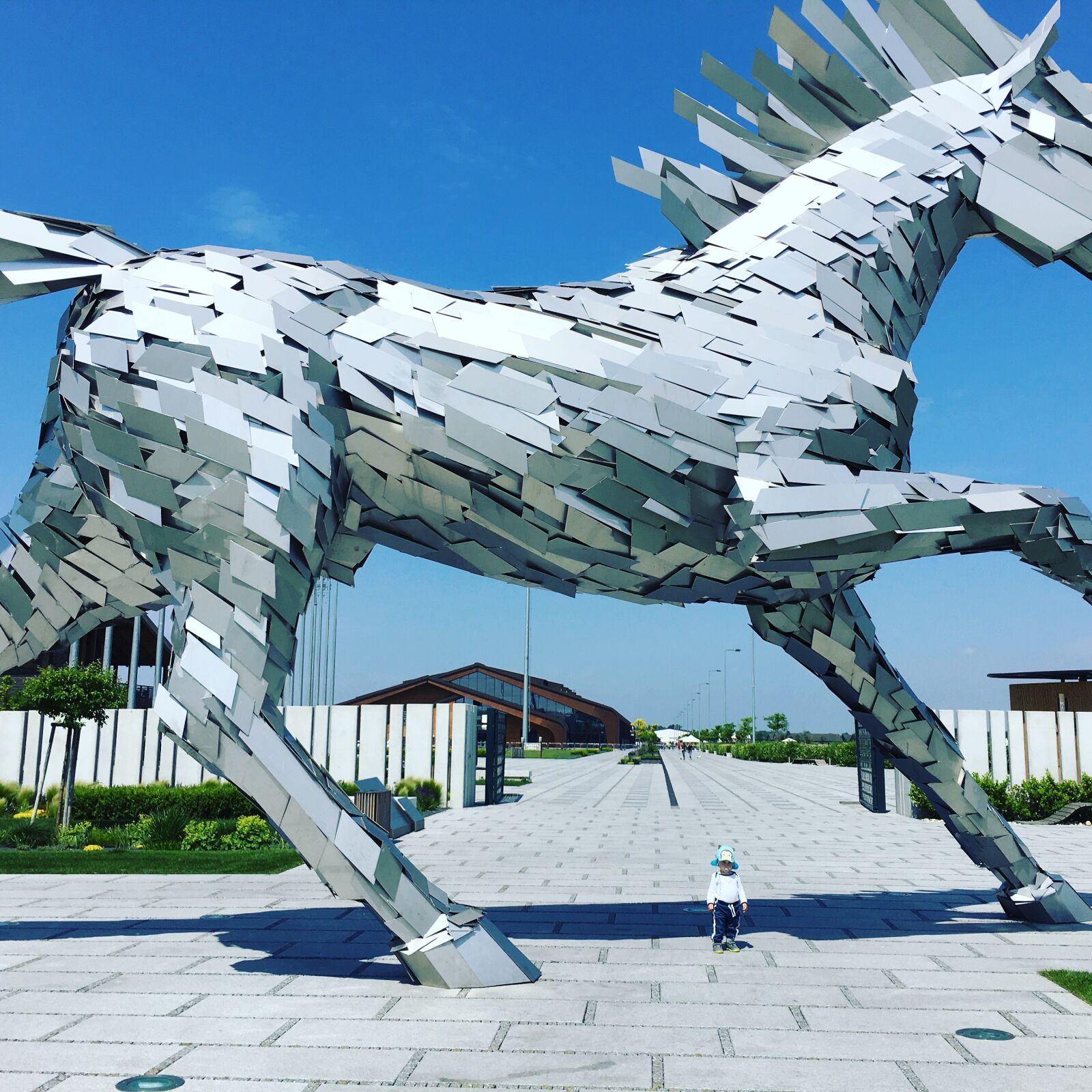 Apple iPhone 6s Plus sample photo. Child, horse, statue photography