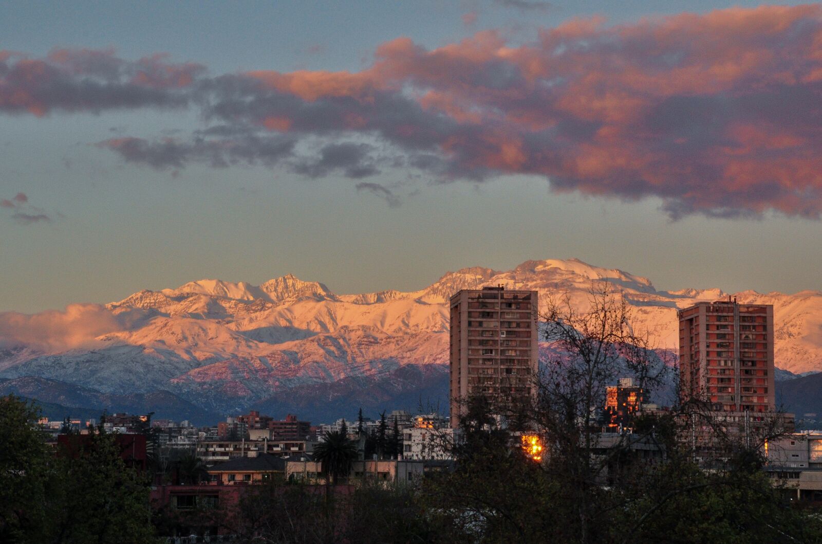Nikon D5000 sample photo. Snowy mountains, city, sunset photography
